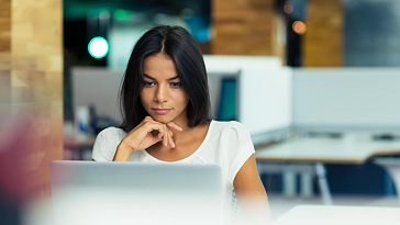 Woman looking at laptop