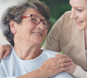 A daughter embracing an older female relative.